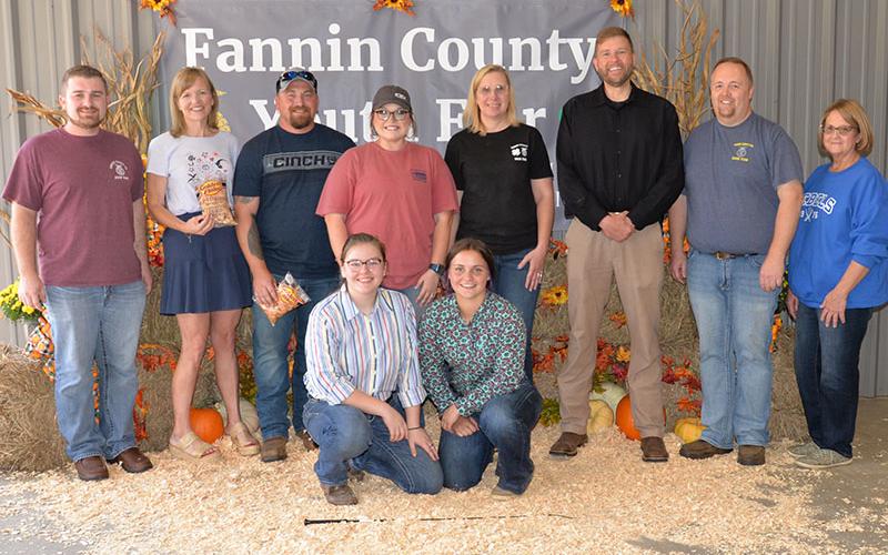 The Fannin County Alumni Association Youth Fair involves volunteers, school officials, and students all working together to make the event  a success for the young people who take part. Shown at the conclusion of the Saturday, September 17, event are, from left, front, Emmie Thomas and Zoe Putnam; and, back, Seth Davis, Shannon Miller, Terry Flowers, Emily Fellenbaum, Jennifer Larson, Dr. Michael Gwatney, Tim Nicholson, and Gigi Thomas.
