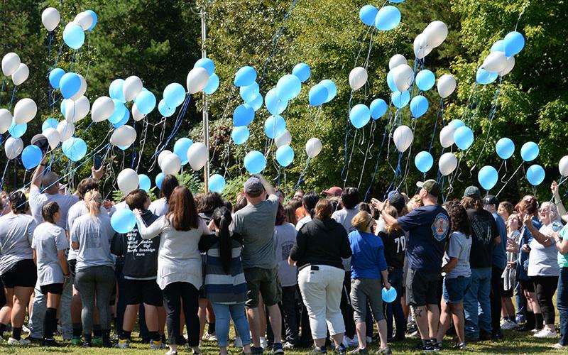 Members of the Fannin County Marching Band along with band parents, and a hand ful of school officials and members of the community, released balloons to honor Josh Cheatham’s memory as the band prepared to travel to the Armuchee Band Invitational in Rome Saturday. The band dedicated its performance to Cheatham.