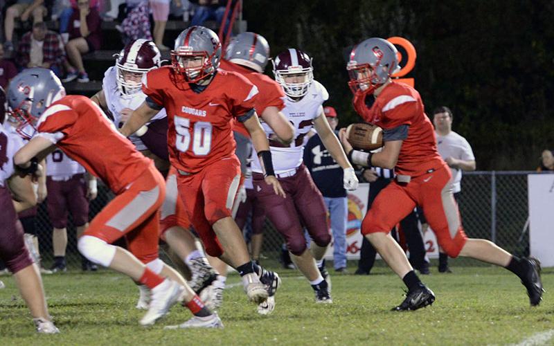Avery Crowder (6) runs the ball while Zach Beech (50) clears his path in the Copper Basin Cougars match up against Tellico Plains High School Friday, September 23. Copper Basin celebrated Homecoming at halftime of the game with the Bears. Kait Kraft was crowned Homecoming Queen and Maddie Cribbs was crowned Homecoming Princess. Their picture appears elsewhere in today’s newspaper.