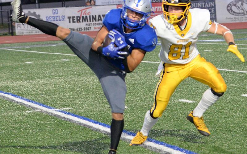 Senior Bryson Holloway secures a catch for Fannin County in recent action for the Rebels football team. The Rebels secured their first region win this past Friday night when they traveled to Gordon Central High School in Calhoun.