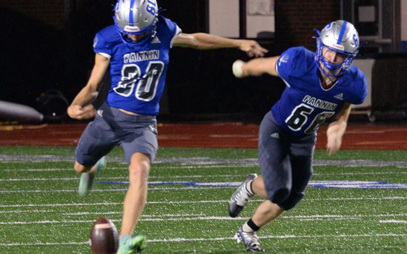 Jack Kantner (80) gets in position to boot the ball down field and Bryan Stiles (66) takes off to meet the ball carrier in recent action for the Fannin County Rebels football team.