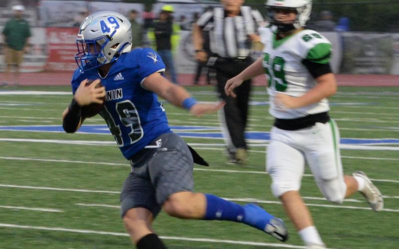 Cade Sands weaves his way around the Pickens defense during the Rebels first win of the football last Friday night at the Fannin High School stadium.