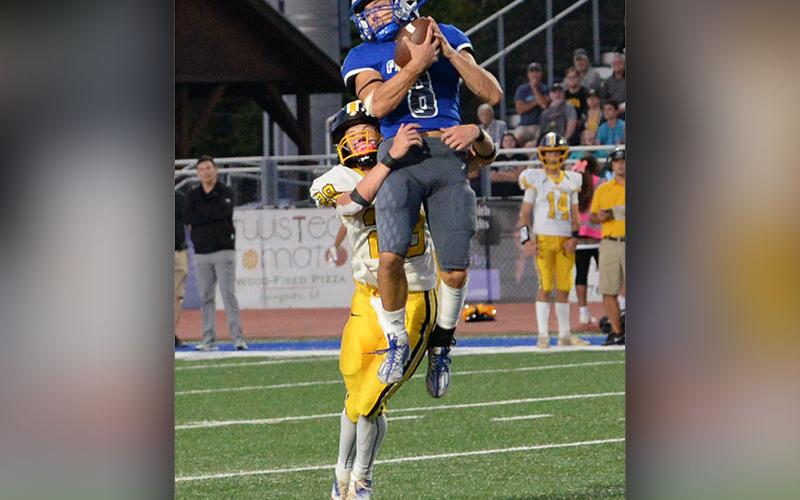 Corbin Davenport went high in the air for the Fannin County Rebels to make this catch against the visiting Murphy High School Bulldogs Friday night at the Fannin County stadium.