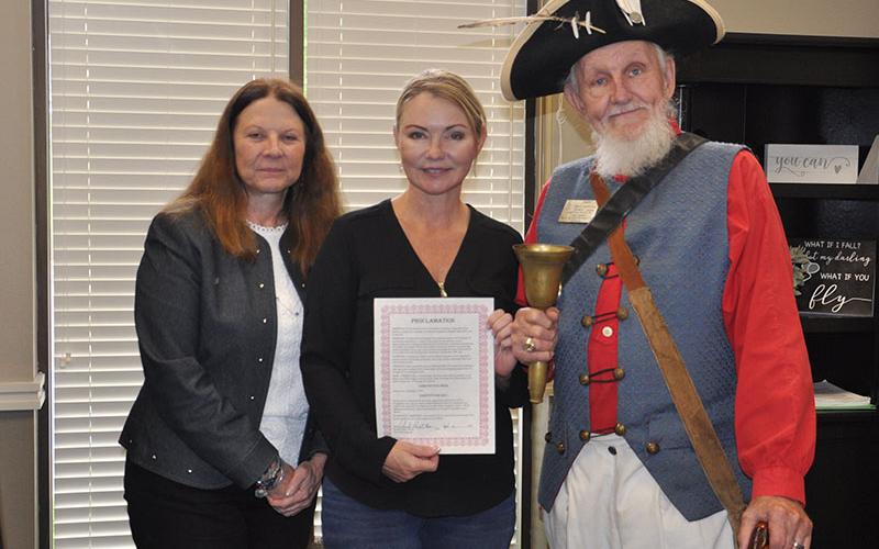 Mayor Rhonda Haight, center, is shown holding the proclamation she signed that deems September 17 through September 23 as Constitution Week and September 17 as Constitution Day. Pictured with her are Unicoi Trail Chapter of the Daughters of the American Revolution member Pam Matthews and Blue Ridge Town Crier Jere McConnell.