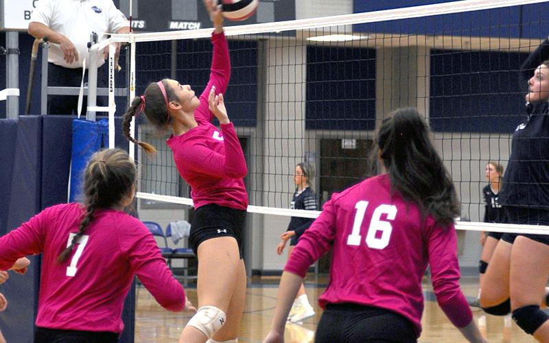 Lexi Gravely makes a return in a Lady Rebels Pink Out match as Maggie Ledford (7)and Rylee King (16) get ready in case of a return.