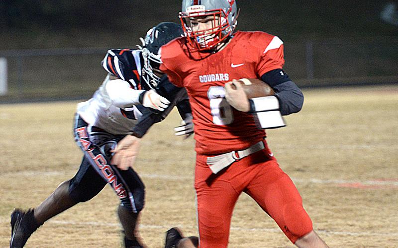 Avery Crowder (6) keep the ball secure as he breaks away from the defender in Friday night’s victory over the North Georgia Falcons.