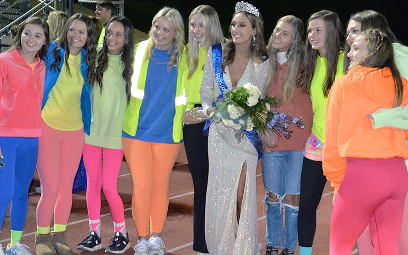 Homecoming Queen Reigan O’Neal smiles with her basketball teammates after being crowned at half time of Friday night’s football game. Pictured are, from left, Courtney Davis, Jayden Bailey, Aaleyah Rogers, Emma Holloway, Ava Queen, Homecoming Queen Reigan O’Neal, Ellie Cook, Macy Hawkins, Reese Lewis and Callie Ensley.