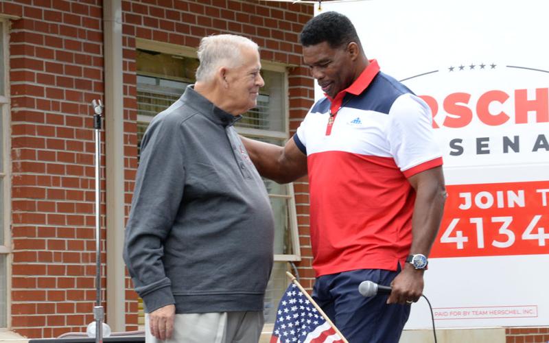 David Ralston, left, District 7 representative and Speaker of the Georgia House of Representatives, introduced U.S. Senate candidate Herschel Walker at the Fannin County Republican Party’s Fall Festival in Epworth Saturday. Bruce Thompson, who is running for Georgia Labor Commissioner, was also on hand as was State Senator Steve Gooch and several local elected officials.