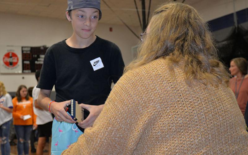 Colbie Thomas listens closely to a valuable financial lesson during Reality Day
