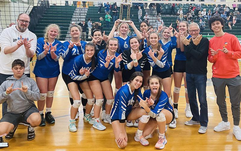 The Lady Rebels volleyball team smile and hold up the “W” after their big Region Championship win against Murray County. Shown are, from left, front row, kneeling manager Ian Delashmitt, Rylee King and Lexi Gravely; middle row, Bailee Stiles, Maggie Ledford, Maddie Pelfrey and Kaylie Davenport; and back row, coach Todd Geren, Kendall Clore, Maddie Usry,  head coach Heather Ades, Ava Queen, Peyton Slone, Cali Tuggle. Alanya Dockery, coach Sam Walker and manager Michael Stephens.