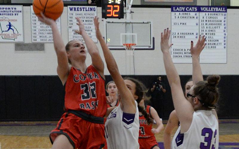 Riley Hall (32) goes for two points for the Copper Basin Lady Cougars in their matchup against Gilmer County in the first round of the ETC tournament in Ellijay Saturday.