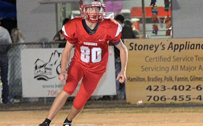 Mason Anderson (80) makes a motion towards the ball in recent action for the Cougars.