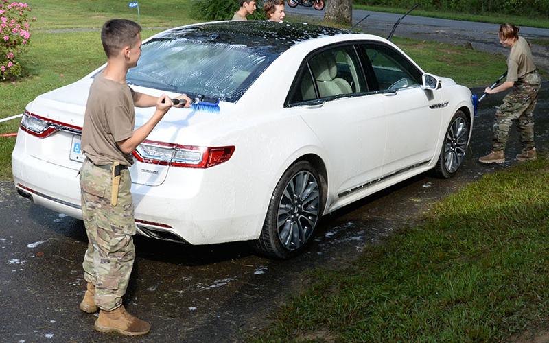 Cadets from Mountain Area Christian Academy’s Christian Junior Reserve Officers Training Corps program worked earlier this year washing cars to raise money for a trip to Utah this summer. The cadets need to raise $15,000 to make the trip focusing on military education. Shown are, from left, Lev Brovko, Genia Lebaen, Jacob Corley and Hannah Corley.