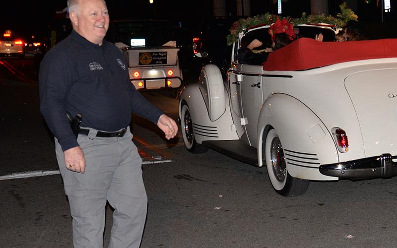 Retiring Blue Ridge Police Chief Johnny Scearce was greeting many of the people who participated in the Light Up Blue Ridge Christmas Parade Saturday night after leading the event through the downtown streets.