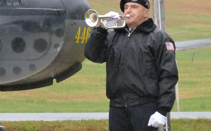 Bill Hall played Taps to conclude the Veterans Day ceremony Saturday.