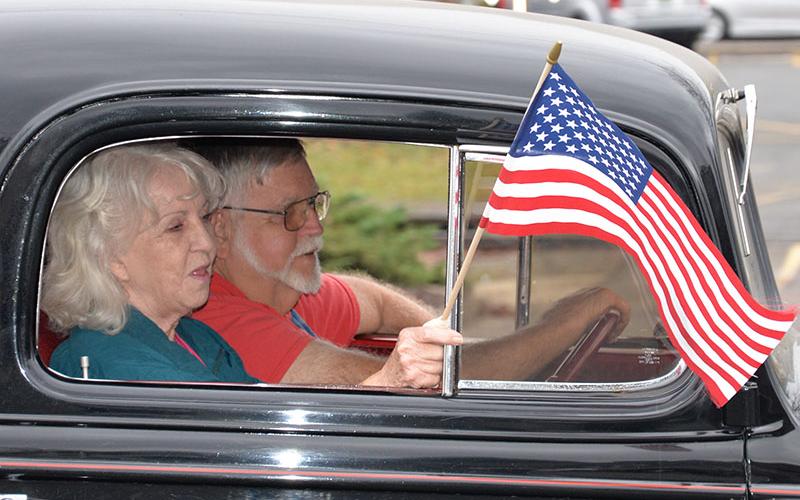United States flags were plentiful during Saturday’s parade to honor Veterans Day.