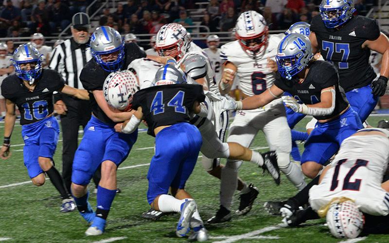 Braden Taylor (10), Nate Maloof (63), Clay Heaton (44), Cooper Born (14) and Logan Long (77) work hard on defense in the Thursday night’s matchup against Haralson County.