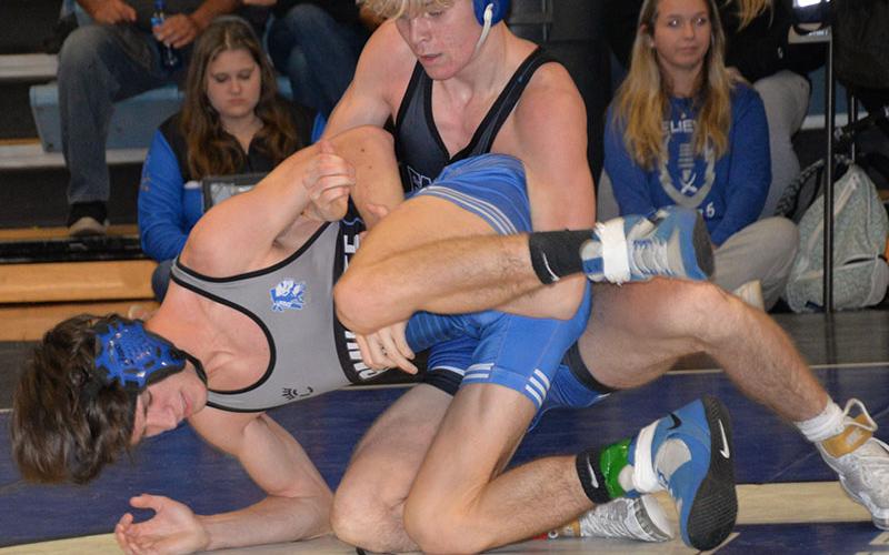 Blake Summers takes the upper ground in a recent match for the Rebels wrestling team.