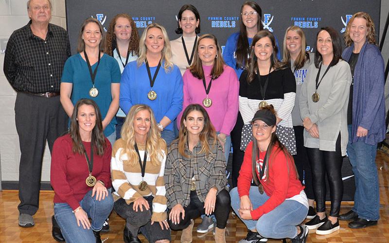 The 2003 to 2004 Fannin County High School Lady Rebels were named Friday night as inductees into Fannin County Sports Hall of Fame. Shown are, from left, front row, Katie Falls Seabolt, Kristin Chastain Kay, Bethany Patterson Kaylor and Natasha Anderson, and, back; Head Coach Johnny Farmer, Brittany Lindsey, Melissa Roberts, Aiden Acker Falls, Stephanie Scearce, Kristian Panter Cooper, Megan Queen Orton, Caitlyn Graham Snider, Jordan Henson Kaylor, Ashley Panter Curtis and Coach Suzianne Green Pass.