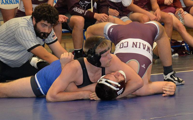 Carson Collis works to pin his opponent in his match against Swain County Friday, December 2. Collis was able to secure the pin and come out with a victory.