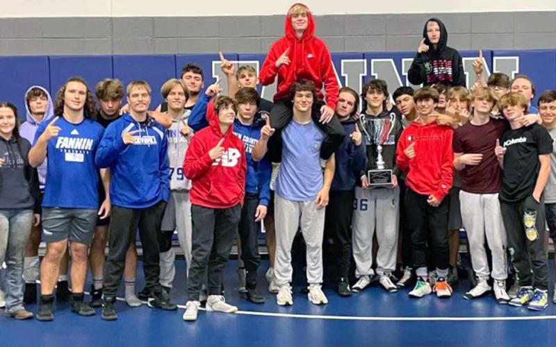 The FCHS Wrestling team smiles and holds up a #1 after being awarded their 515 Classic Championship trophy. Shown are, from left, Coach Chuck Patterson, Chelsey Frye, Drake Cantrell, Jacob Dye, Matthew Crowder, Carson Collis, Taylor Collis, Logan Long, Landon Poole, Thomas Golden, Jackson Mercer, Corbin Davenport, Blake Summers, Colby Shaw, Cooper Moreland, Conrad Head, Lionel Olivera, Andrew Crowder, Tristan Siler, Christen Newberry, PJ Cole, Jayden Brown, Keaton Wilson, Jacob Green, Finn Thoreson, Braylin