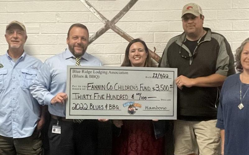 The Fannin County Children’s Fund, administered by the Fannin County School System, received a $3,500 donation thanks to the 2022 Blues &amp; BBQ Festival that is a project of the Blue Ridge Lodging Association. The fund helps school youngsters with a variety of needs. Shown during the presentation of the check are, from left, Greg Spencer, Fannin County High School Principal Scott Ramsey, children’s fund representative Tara Cantrell, Paul Gribble and Dena Martin.