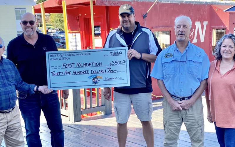 The Ferst Foundation, which provides books free of charge to some of Fannin’s youngest children, received a $3,500 donation thanks to the Blues &amp; BBQ Festival. The free book effort is a project of the Kiwanis Club of Blue Ridge. Accepting the check from festival organizers were, from left, Steven Miracle and Troy Shirbroun of the Kiwanis Club and festival organizers Paul Gribble, Greg Spencer and Dena Martin.