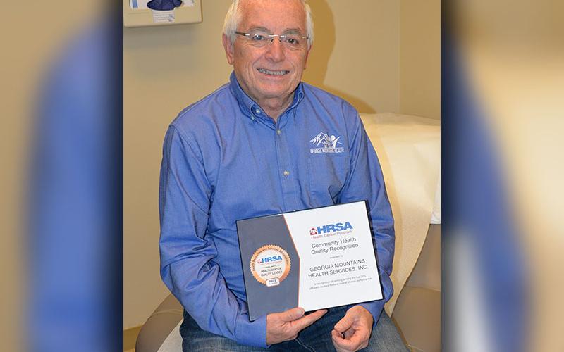 Steven Miracle, chief executive officer of Georgia Mountains Health, displays the facility received as a Quality Leader from the U.S. Health Resources and Services Administration.