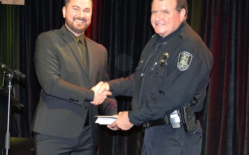 Peter Kusek, right, was named the McCaysville Police Department Officer of the Year by Police Chief Michael Earley.