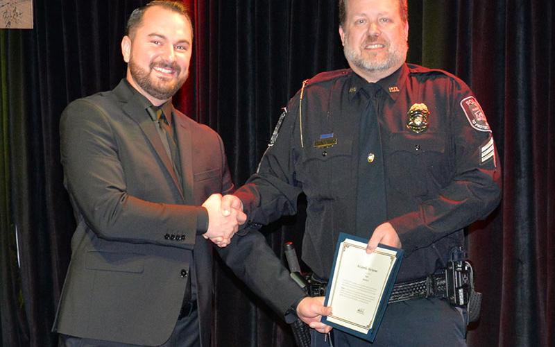 The chief’s Star Award was presented by McCaysville Police Chief Michael Earley, left, to Sergeant Brian Collis for the countless hours Collis has put in preparing a grant application for the department.