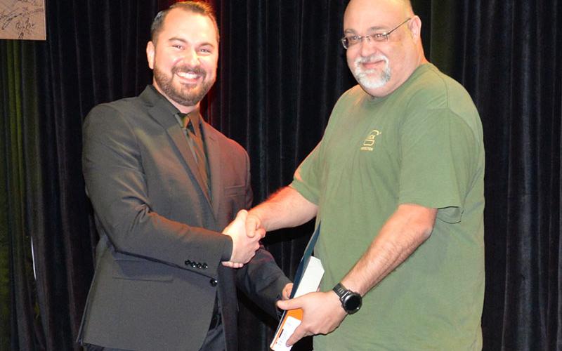 Ronald Christopher “Chris” Pinson, right, is the McCaysville Police Department’s Employee of the Year. He is congratulated by Police Chief Michael Earley.