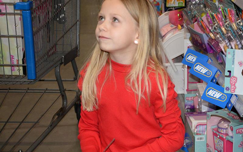 Shopping decisions are never easy as this little girl’s face shows.