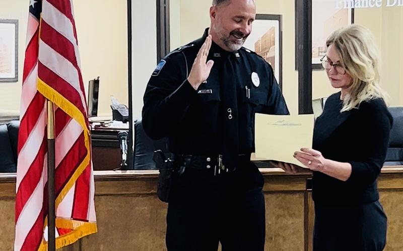New Chief of Police Robbie Stuart is shown as he is sworn in to the chief position by Blue Ridge Mayor Rhonda Haight.