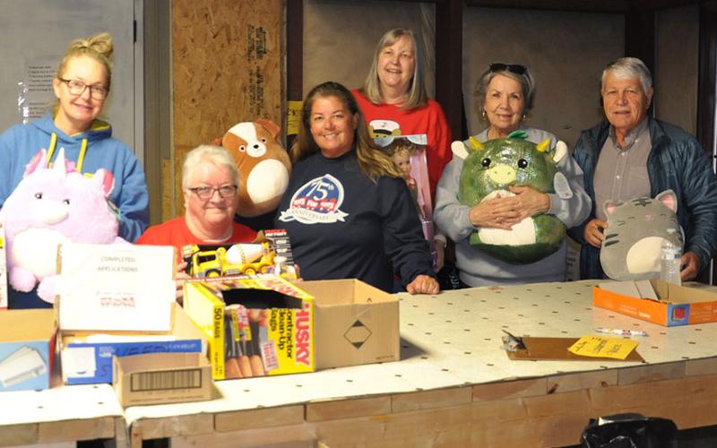 Getting ready for the annual Toys for Tots distribution is a full-time effort for many volunteers. Cathy Love Queen, Jody Guttridge, Toys for Tots Executive Director Cheryl Turner Jordan, Gale Mancuso, Sue Warner and Joel Warner, from left, are shown as they work toward gathering Christmas presents that will be handed out this weekend.