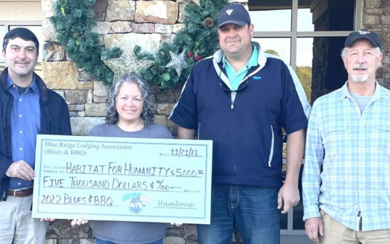 Habitat for Humanity was one of the recipients of the donations presented to local organizations thanks to the 2022 Blues &amp; BBQ Festival sponsored by the Blue Ridge Lodging Association. Habitat homes traditionally provide shelter for families or single parents with children. Thomas Arp left, accepted the $5,000 check from festival coordinators Dena Martin, Paul Gribble and Greg Spencer.