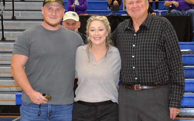 Jordan Farmer, left, was accompanied by his wife and father, Brianna Farmer and Johnny Farmer, when his nomination to the Fannin County Sports Hall of Fame was announced.