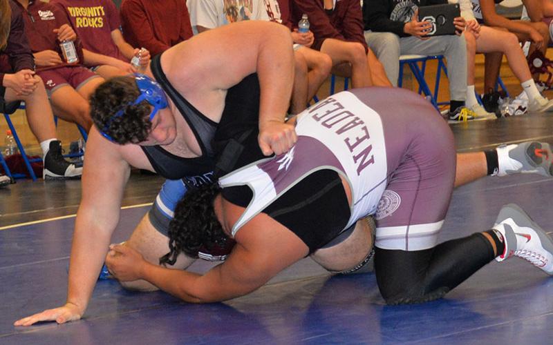 Fannin County High School enior Logan Long takes the upper ground against his opponent in wrestling action last Friday at FCHS. Long won his with a pin