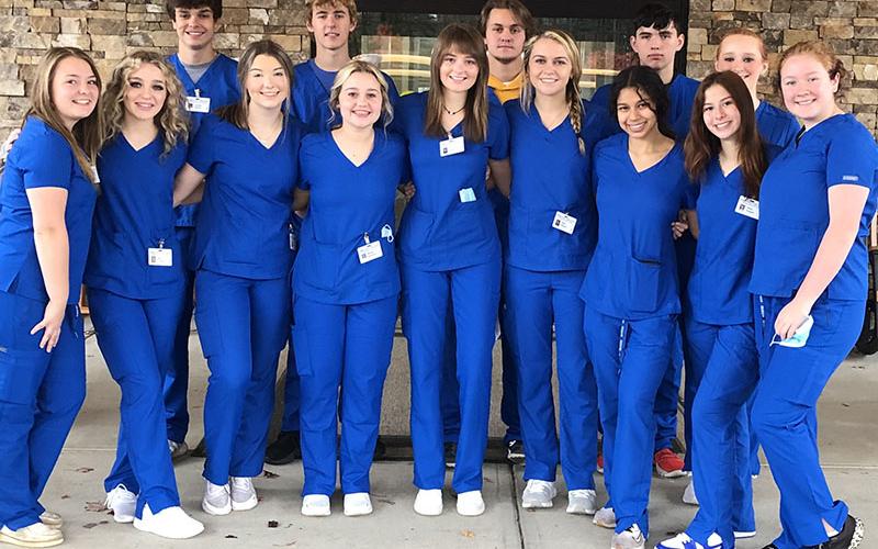 Fannin County High School Nursing Pathway students are able to obtain a Georgia certification as a Certified Nursing Assistant (CNA) . This certification enables students to find immediate employment opportunities in the healthcare field as a CNA. The students pictured finished their CNA training and took their state certification test in December. Shown are, front row, Julie Biddy, Eden Callegari, Abby Baliles, Maddie Buchanan, Clara Payne, Riley Reeves, Angela Alvarez, Devin Hogsed, Ivy Hyde; back row, le