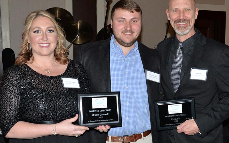 Two outgoing members of the Fannin County Chamber of Commerce Board of Directors, Britton Quintrell, center, and Rob Kaser, were recognized for their service by Suzanne Davenport, chairwoman of the chamber board of directors.