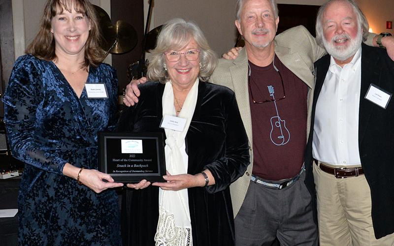 Snack in Backpack received the Chamber of Commerce Heart of the Community Award Saturday night. Manda Gwatney presented the award to Snack Executive Director Deby Beck, Greg Spencer and Carl Pruett. The organization has packed over one million backpacks filled with food for students.