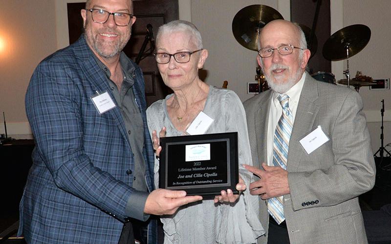 The Fannin County Chamber of Commerce honored Joe and Cila Cipolla with a Lifetime Member Award Saturday night. Troy Shirbroun, left, presented the Cipollas with the honor.