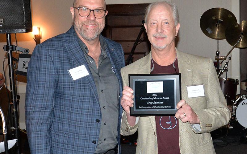 Greg Spencer, right, was honored as the Fannin County Chamber of Commerce’s Outstanding Member. Troy Shirbroun presented the honor. Spencer was honored for his work with Blues &amp; BBQ, Snack in a Backpack, and several other volunteer efforts.