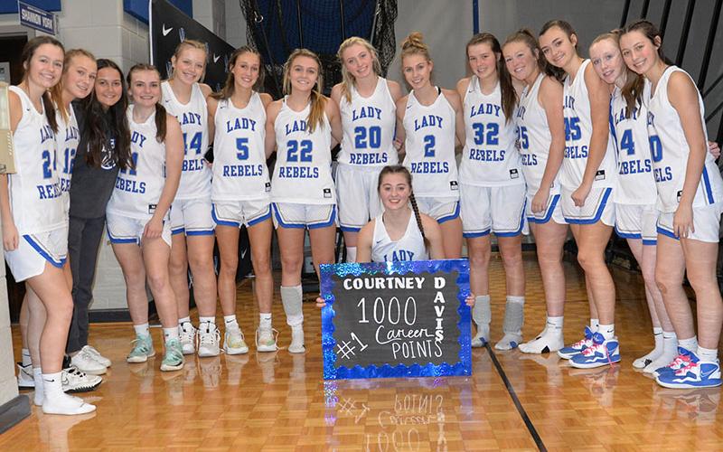 Fannin County Lady Rebel Junior Courtney Davis, kneeling, celebrates her 1,000th career point with her teammates after the game against Elbert County Saturday, January 7. Shown are, from left, Jayden Bailey, Callie Ensley, Eugenia Garcia, Maggie Ledford, Emma Holloway, Reigan O’Neal, Riley Reeves, Ava Queen, Ellie Cook, Macy Hawkins, Addison Smith, Reese Lewis, Emma Buchanan and Avi Ethington.