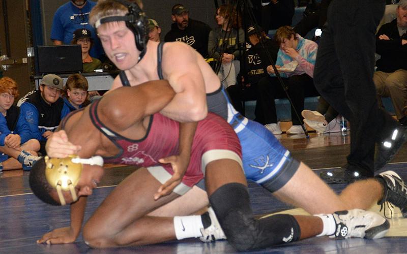 Senior Carson Collis takes the upper ground against his Vidalia opponent Saturday, January 14. Collis would go on to win this match with a pin.