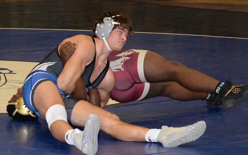 Senior Corbin Davenport works hard for a pin in his match against a Washington Saturday, January 14.