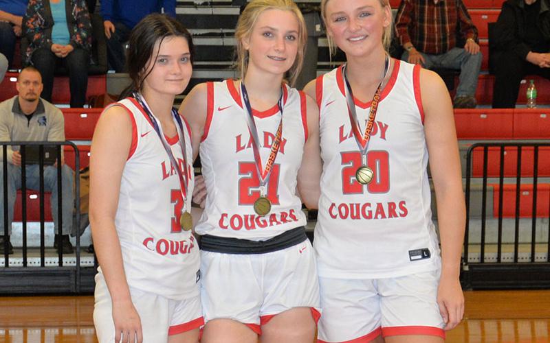 From left, Brilee Harris, Alexis Hyatt and Sapporiah Ross were selected for the All-District Tournament team.