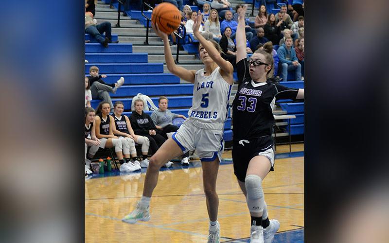 Lady Rebels Senior Reigan O’Neal  (#5) shoots for a contested two in recent Fannin basketball action.