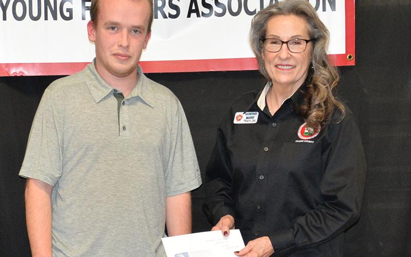 Nick Wolschlager was named the Beginning Agriculture Producer by the Fannin County Young Farmers Association. He was presented his award by Marie Taylor, representing both the Young Farmers and North Georgia Master Gardeners.
