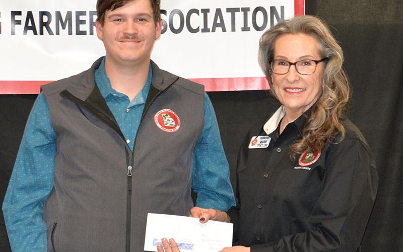 Patrick Conner was named the Agriculture Spokesperson for his participation in the Georgia Young Farmers State Conference. Marie Taylor presented Conner his award.