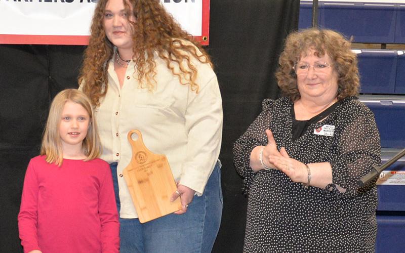 Terri Long, center, the owner of Longs Family Farm, accepted the honor as Farm Family for 2022. Margery Dallas, right, presented the award to Terri and her daughter.
